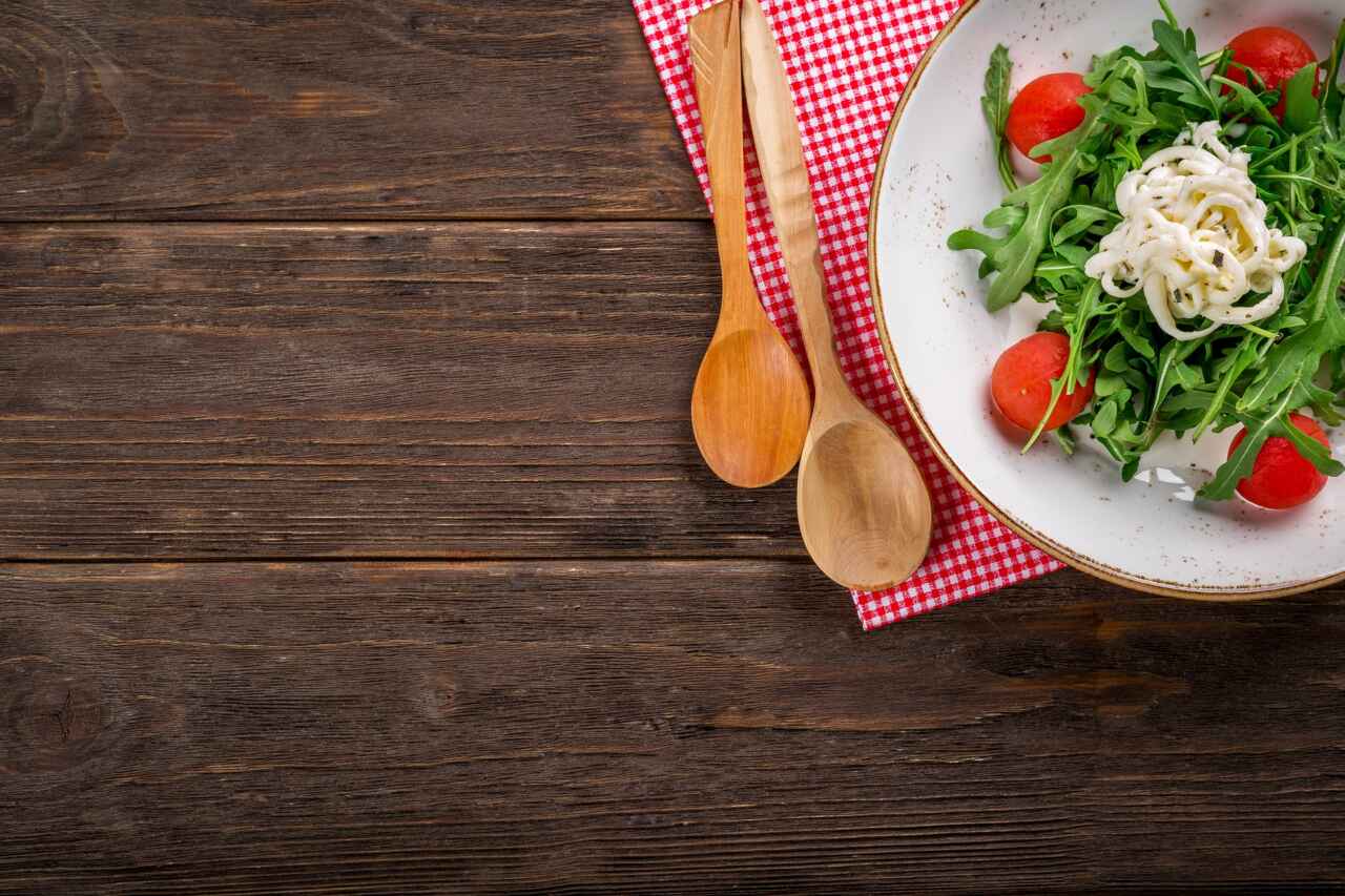 Food on a table with a couple of wooden spoons